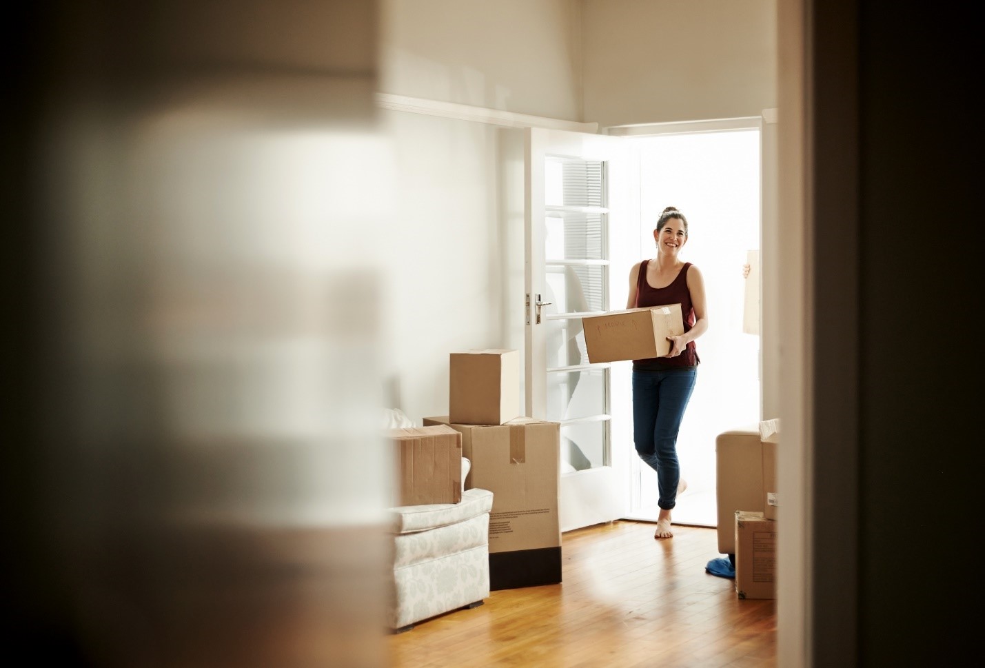 women moving boxes